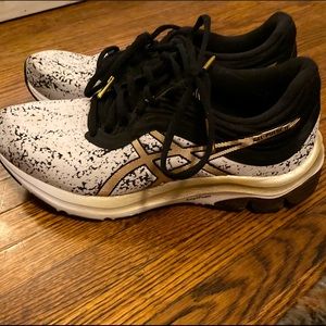 Women’s black gold and white ASICS size 7